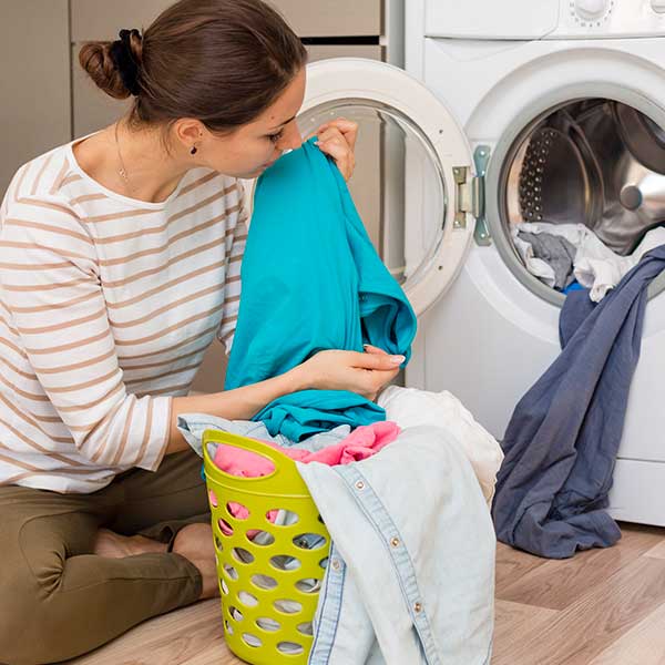 Woman smelling laundry